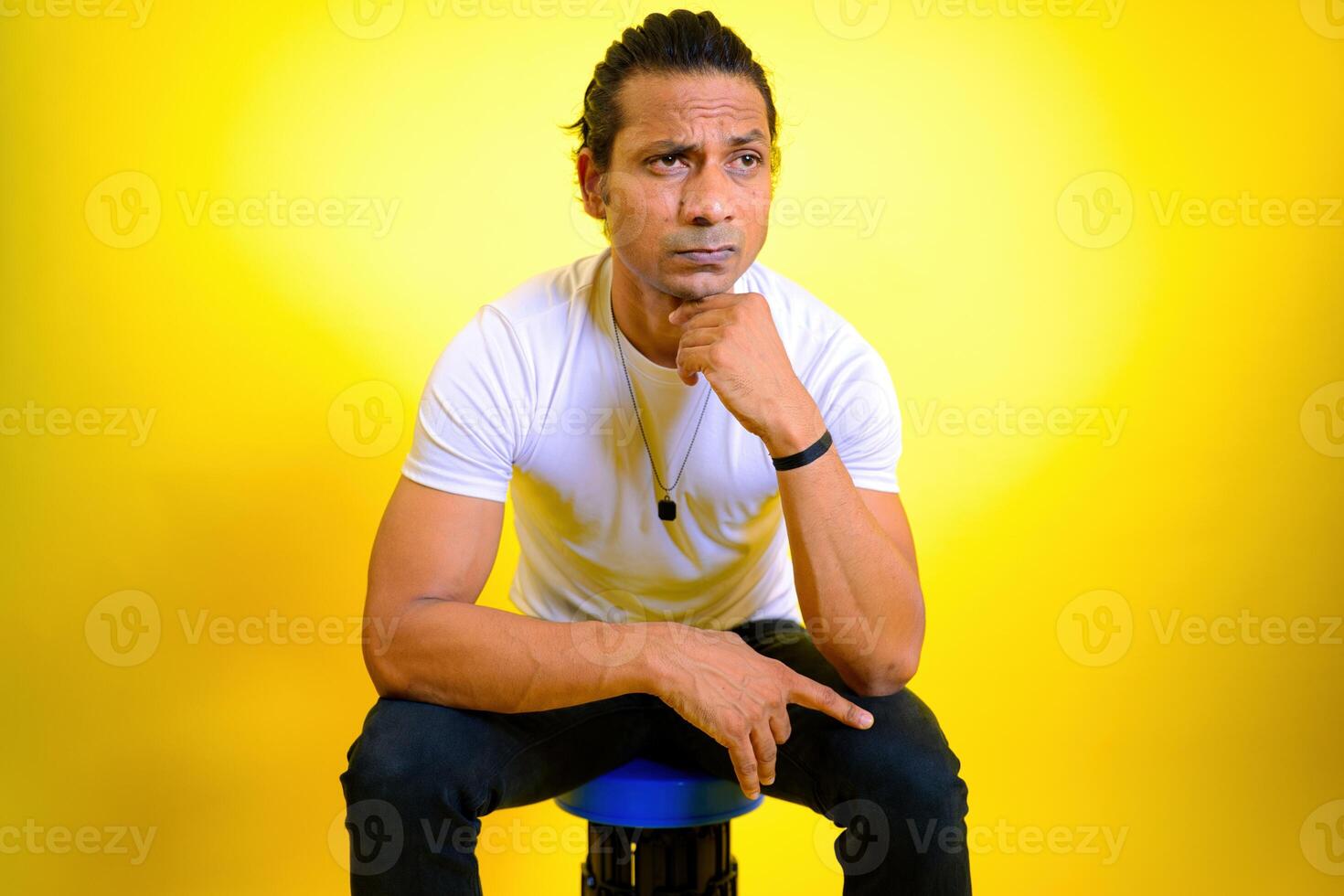Unhappy stressed man sitting alone photo