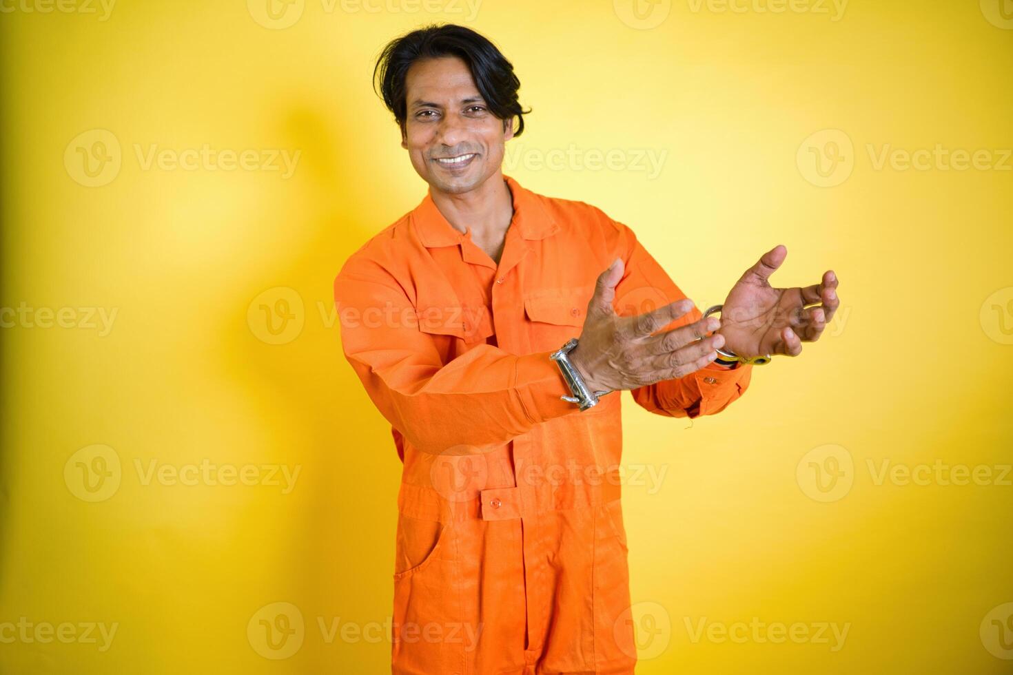 Smiling man stand in handcuff photo