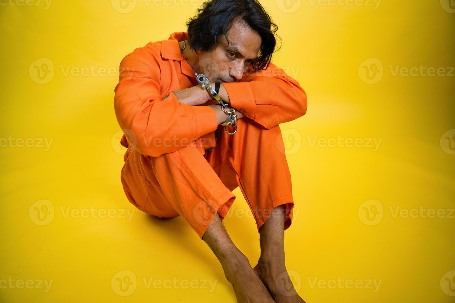 Depressed young man in prison photo