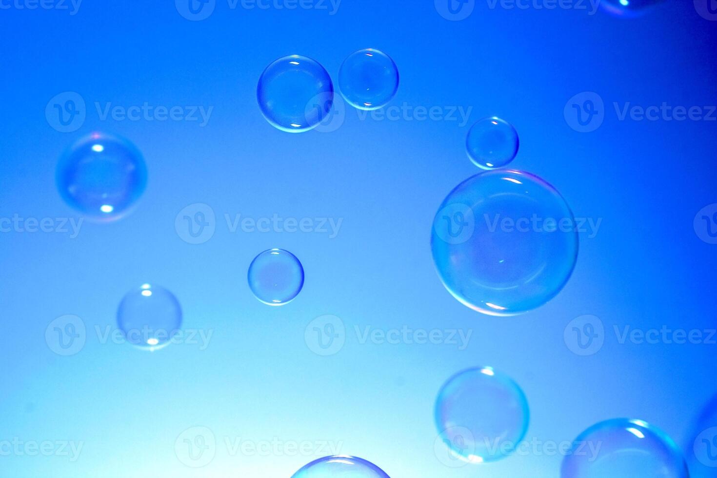 Bubbles on blue background photo
