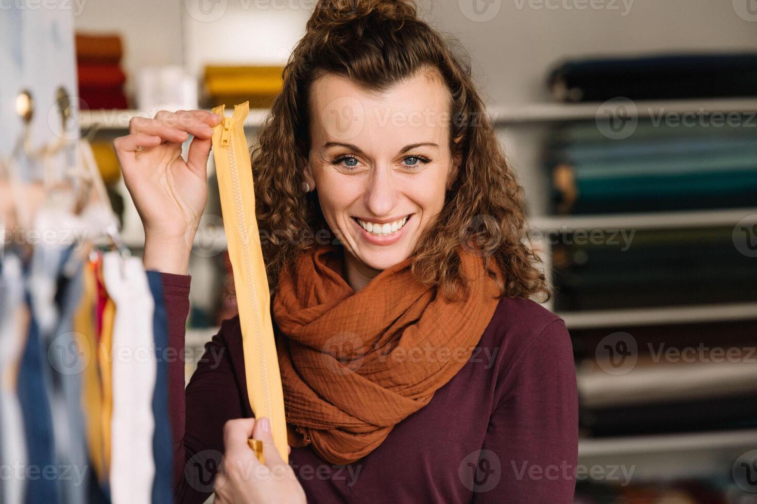 Charming Fashion Designer with a Zipper in Her Creative Shop photo