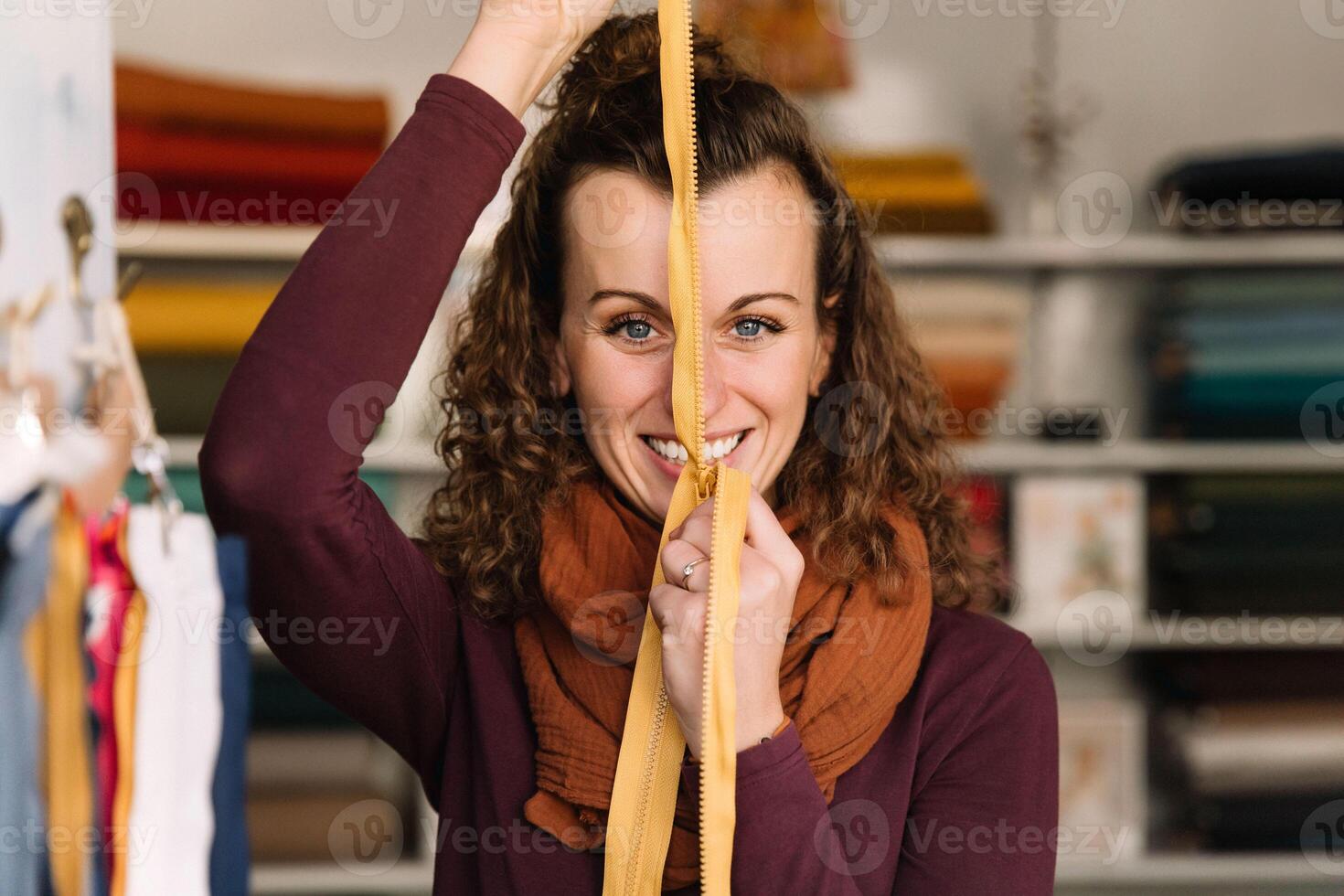 Charming Fashion Woman with a Zipper in Her Creative Textile Shop photo