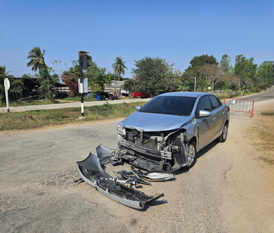 Bronze, gray or grey car broke or accident and crash with 6 wheel truck with trailer on street or road. Damaged or injured on front bumper and car radiator. Broken and insurance of vehicle concept. photo