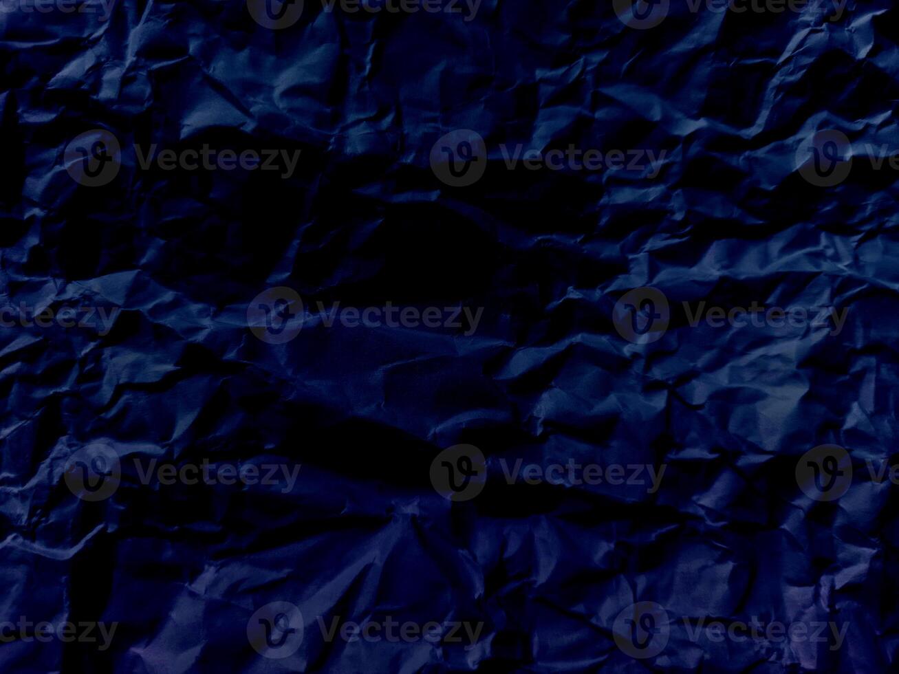 Abstract wrinkled or Free photo crumpled blue or purple paperboard or empty canvas or paper surface or fabric stain background.