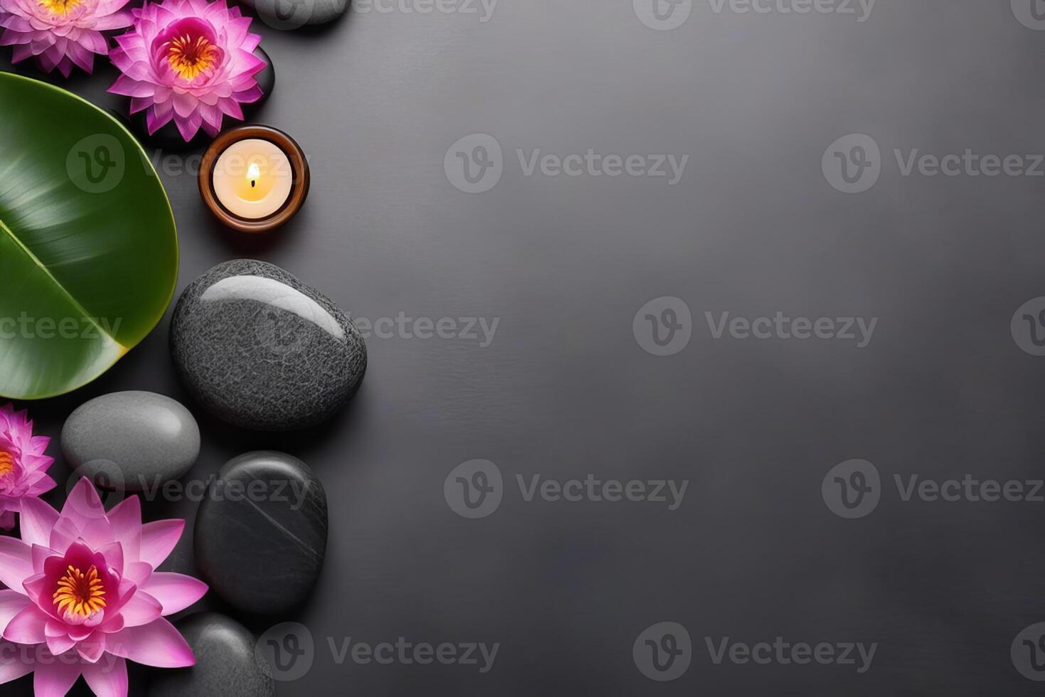 Spa gray background with massage stones, exotic flowers and copy space. photo
