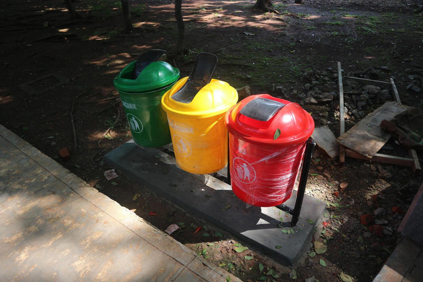 Colorful Recycling Bins in Park photo