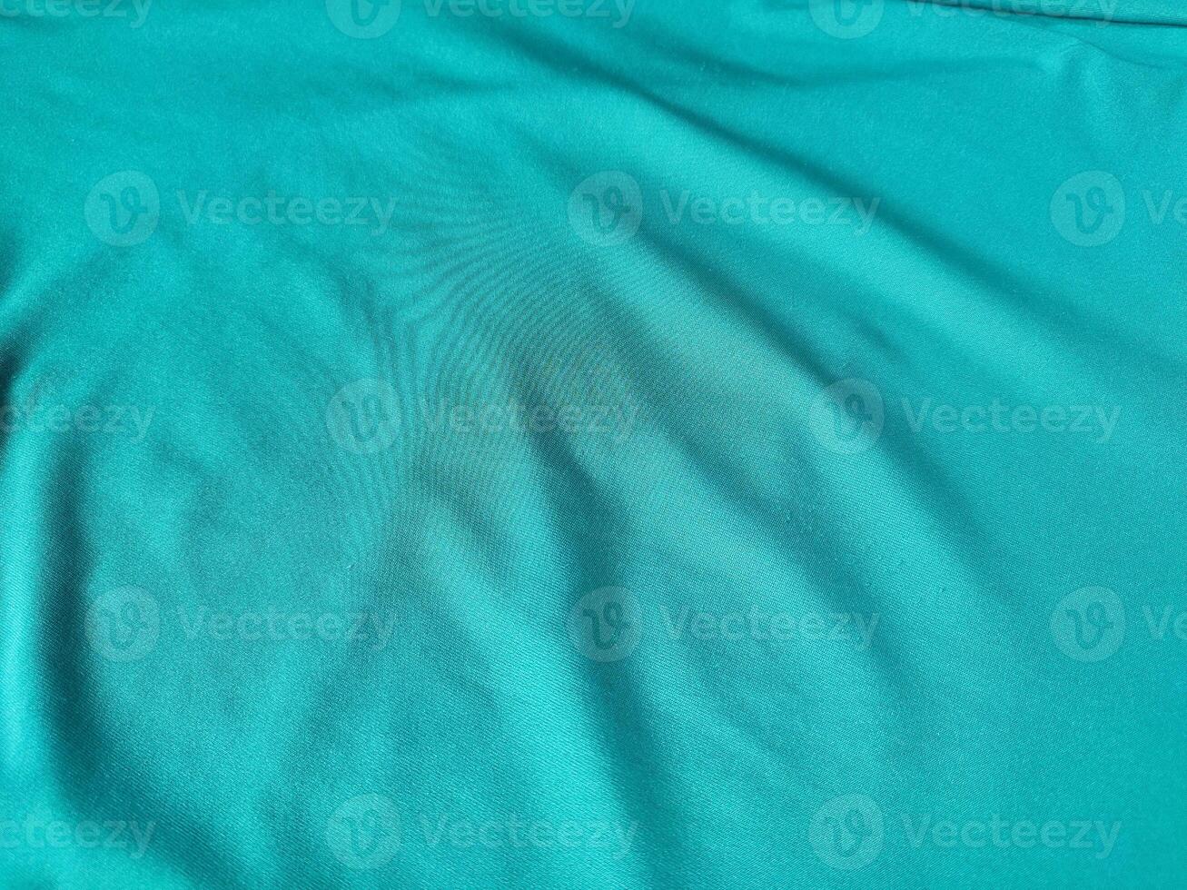 Cyan colored fabric texture and background photo