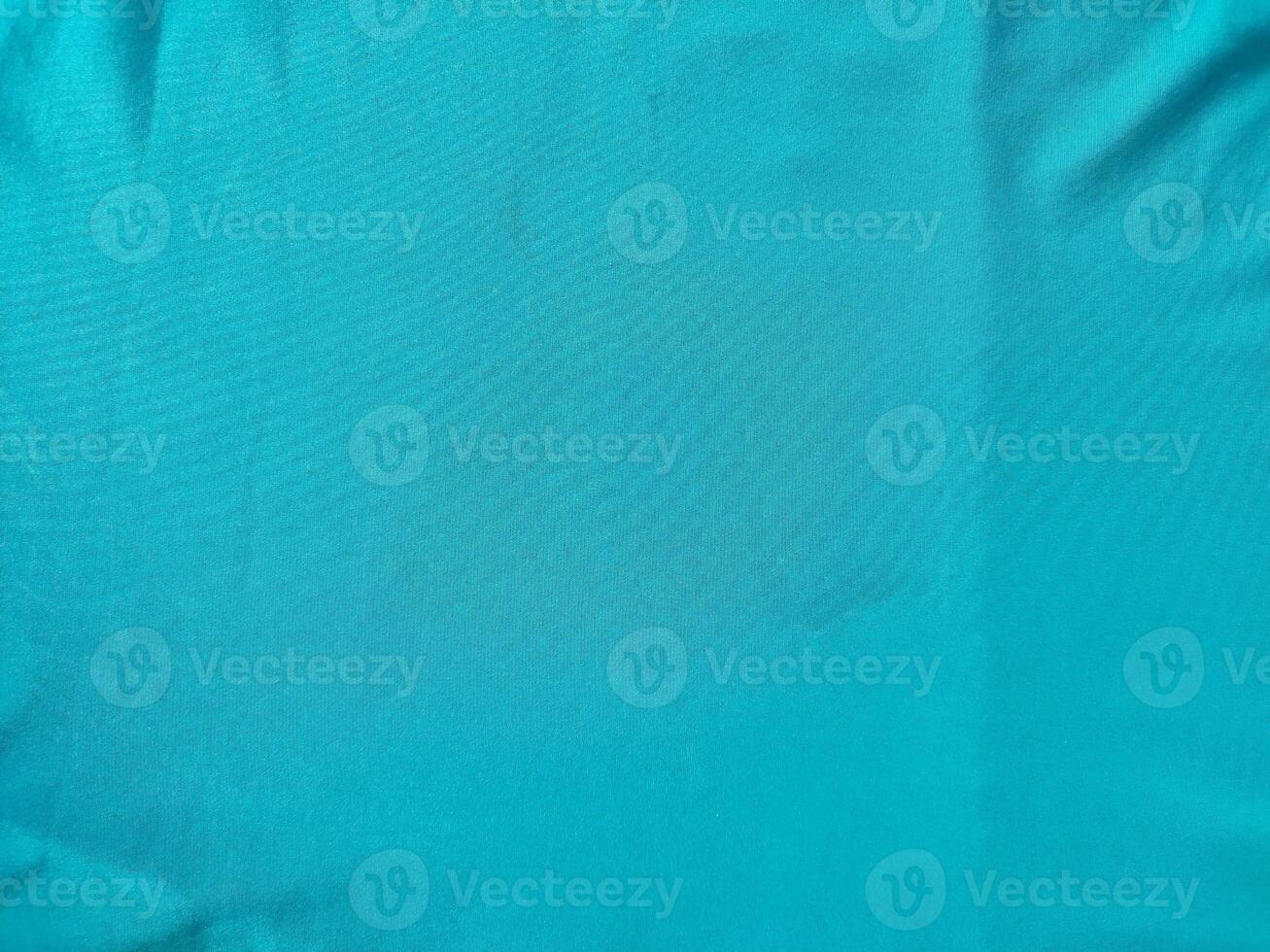 Cyan colored fabric texture and background photo