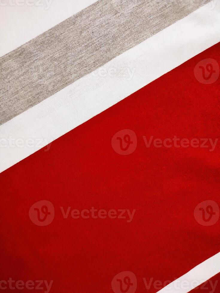 The texture and background of the fabric is white, gray and red photo