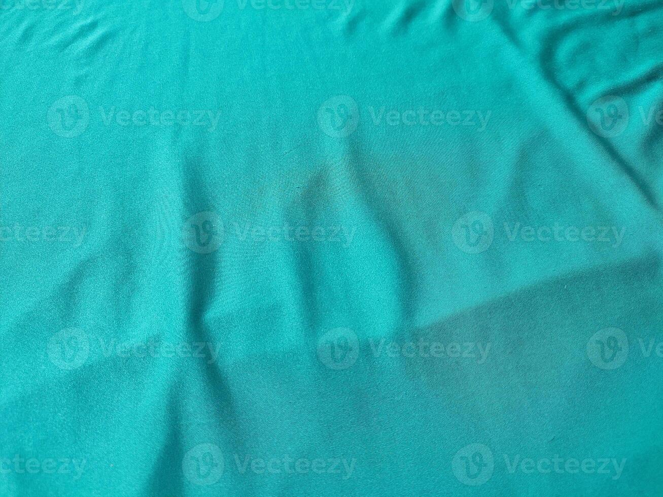 Cyan colored fabric texture and background photo