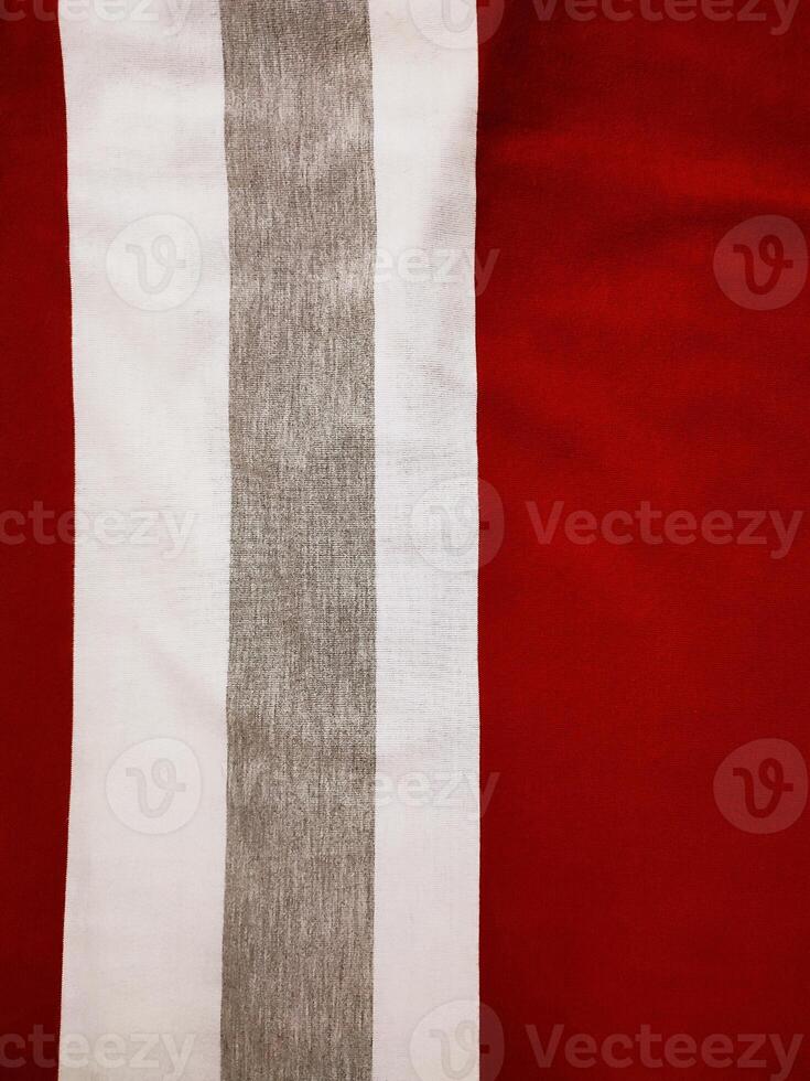 The texture and background of the fabric is white, gray and red photo