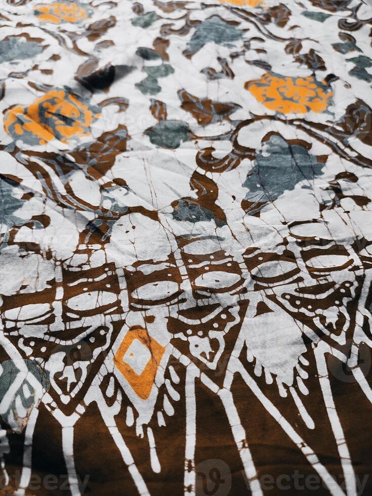 The fabric is patterned with a dense arrangement of blooming floral motifs in medium tones photo