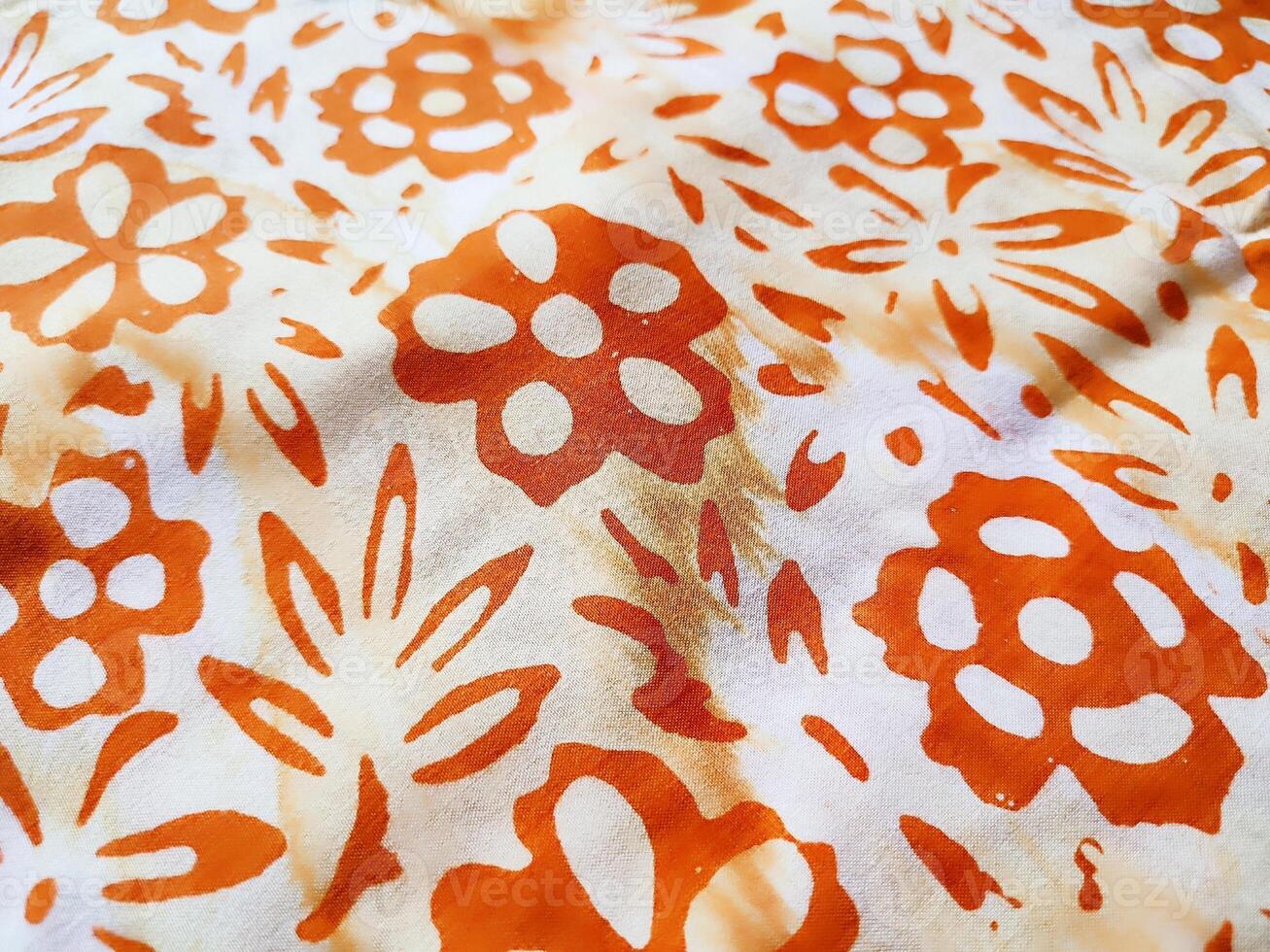 The fabric is patterned with a dense arrangement of blooming floral motifs in medium tones photo