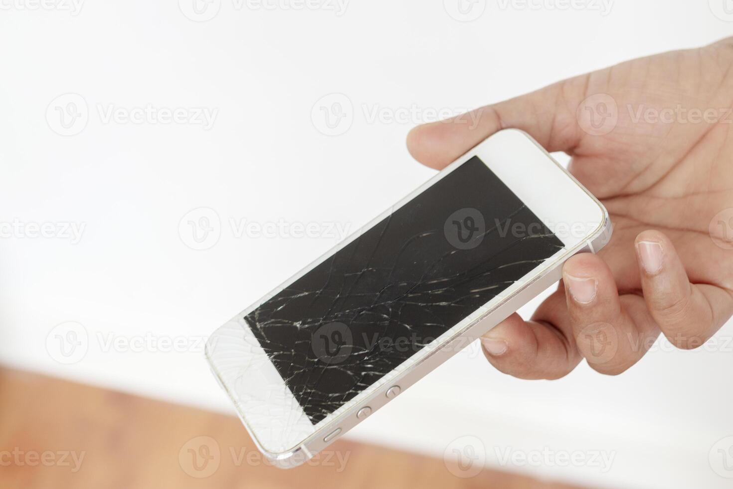 Hands holding broken mobile smartphone. photo