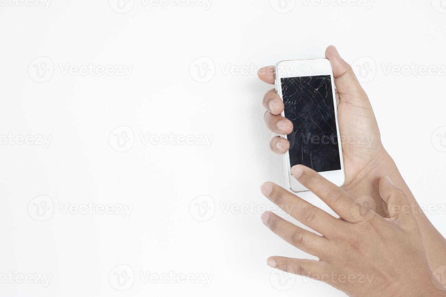 Hands holding broken mobile smartphone. photo
