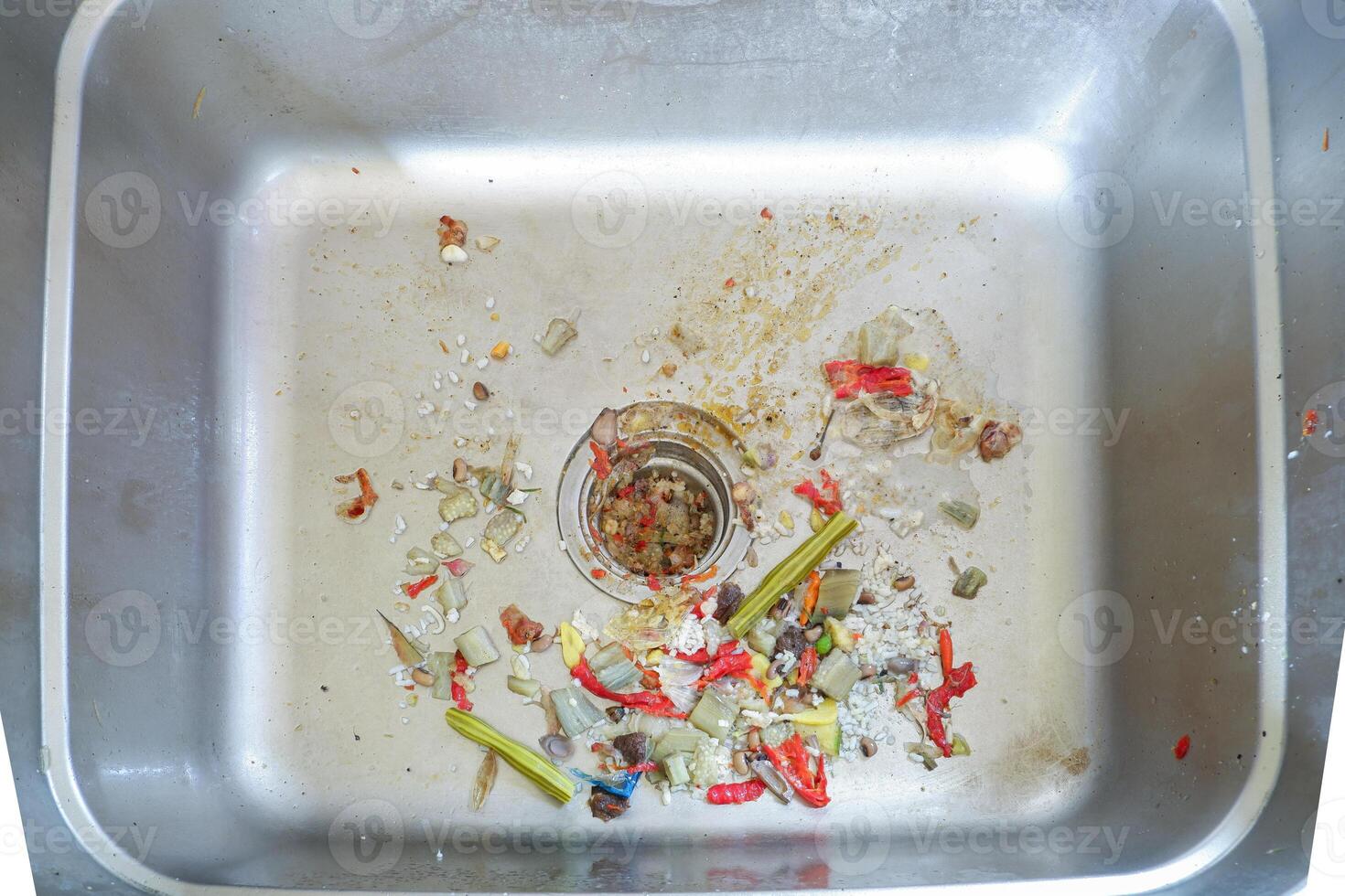 the sink is clogged with food residue. food waste can be used as natural compost photo