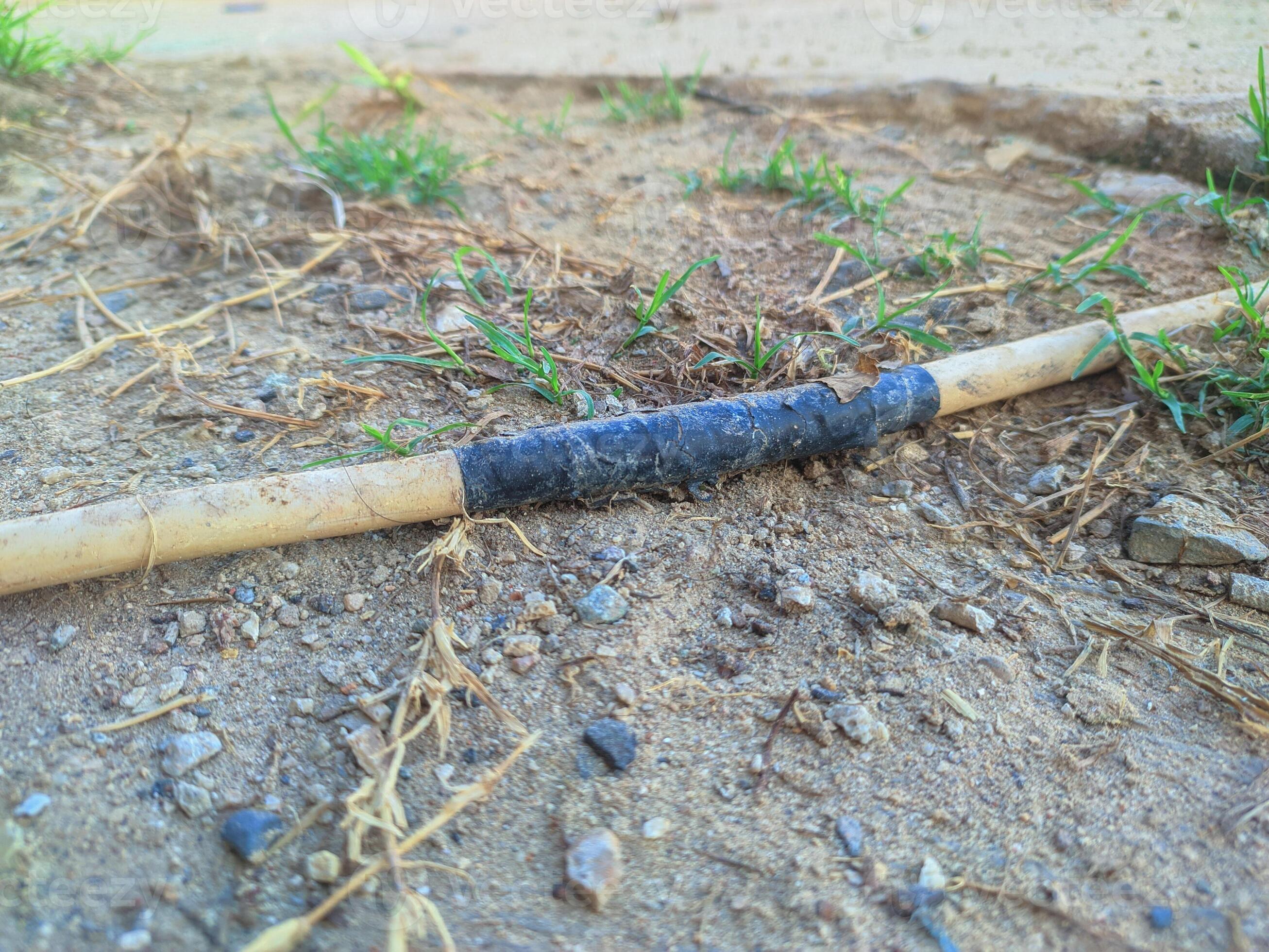 cables connected using black insulation run across the ground