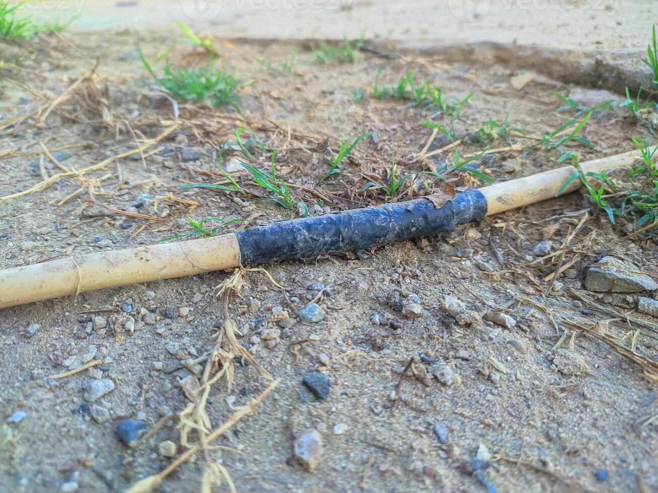 cables connected using black insulation run across the ground. electrical hazard work safety