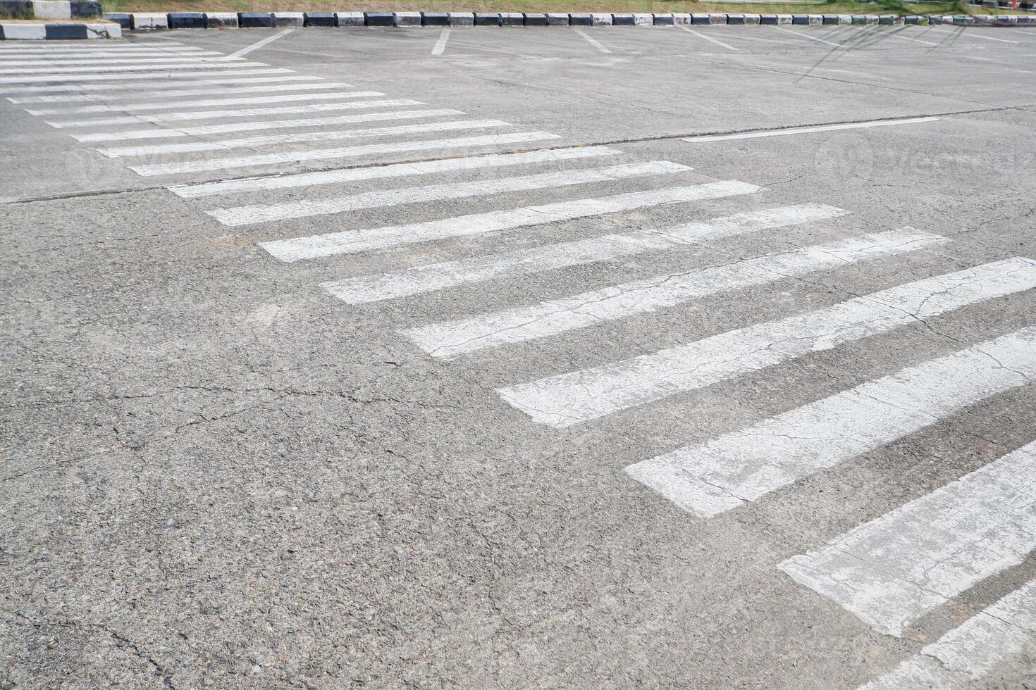 paint faded black and white lines. an empty zebra crossing without anyone photo