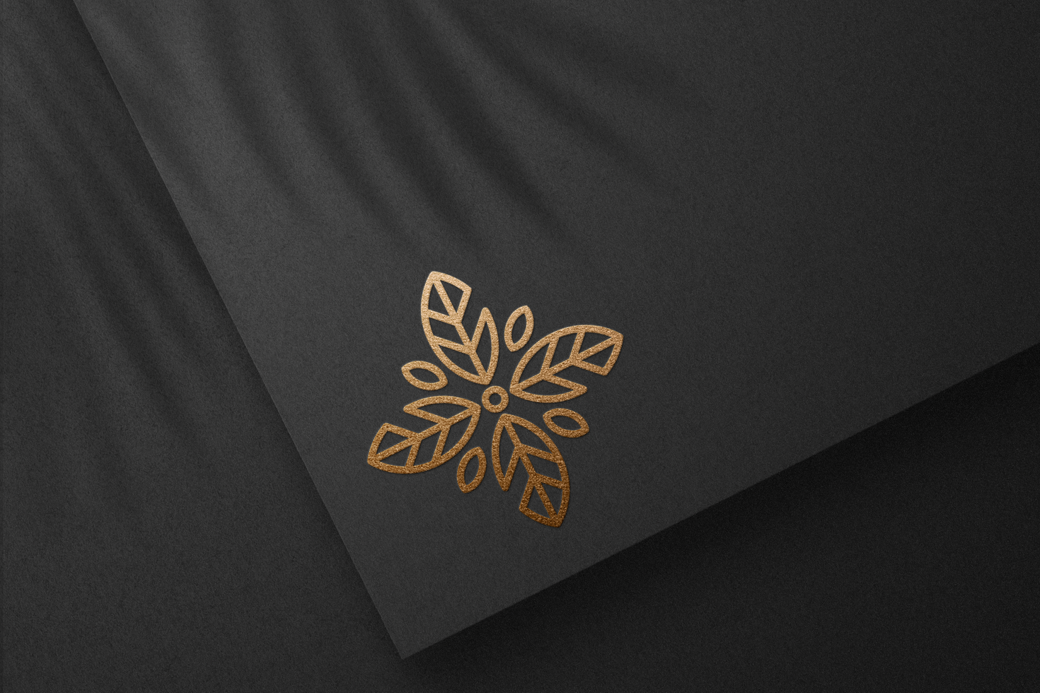 Logo Mockup with Gold Foil on Black Paper Textured psd