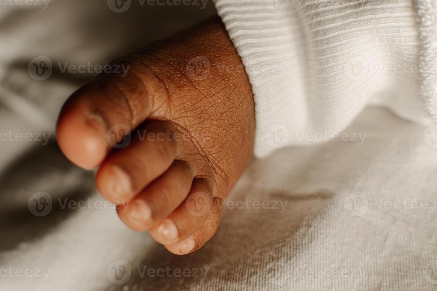 a tiny feet of baby child. photo