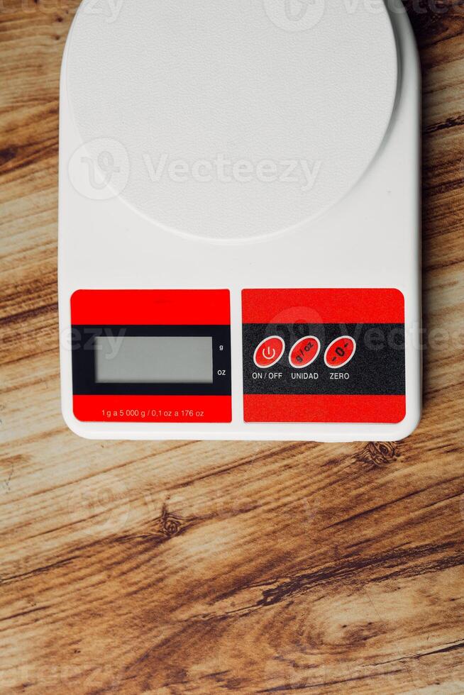 Vertical shot of a kitchen scale. photo