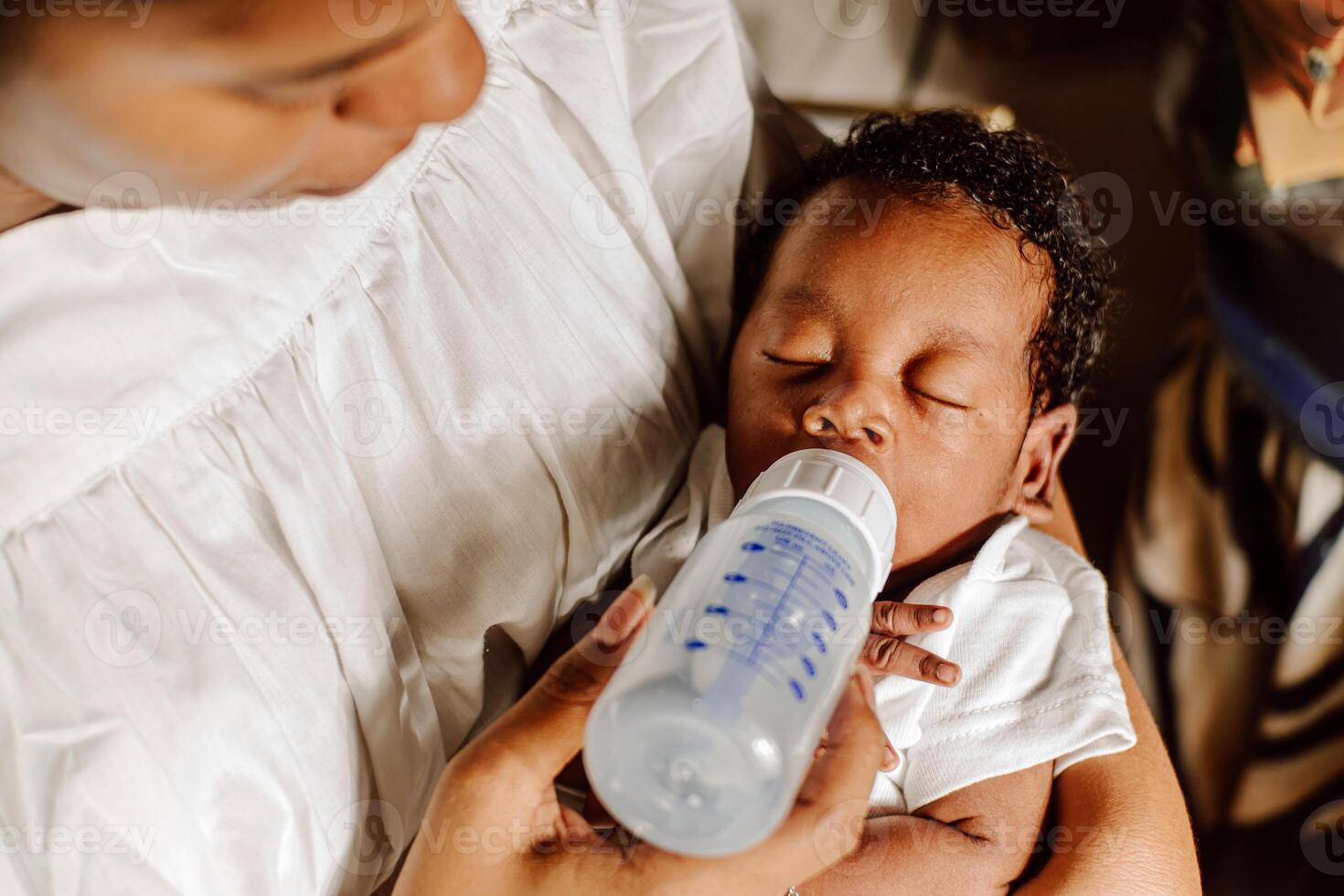 newborn drinking bottle milk photo