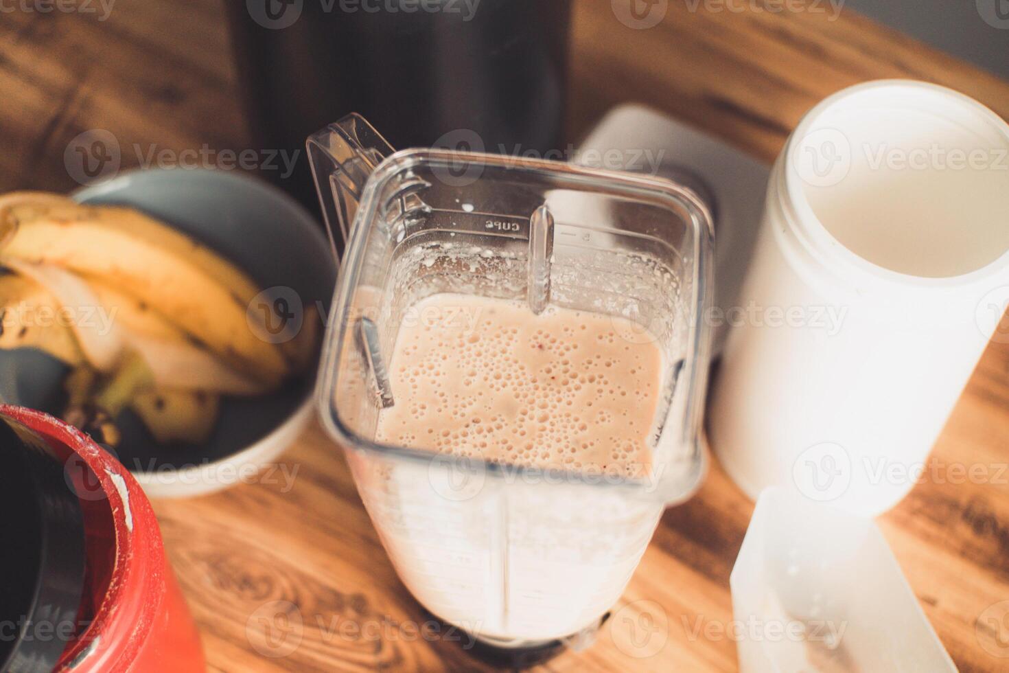 Overhead shot of a blender glass with a nutritious smoothie, healthy lifestyle concept. photo