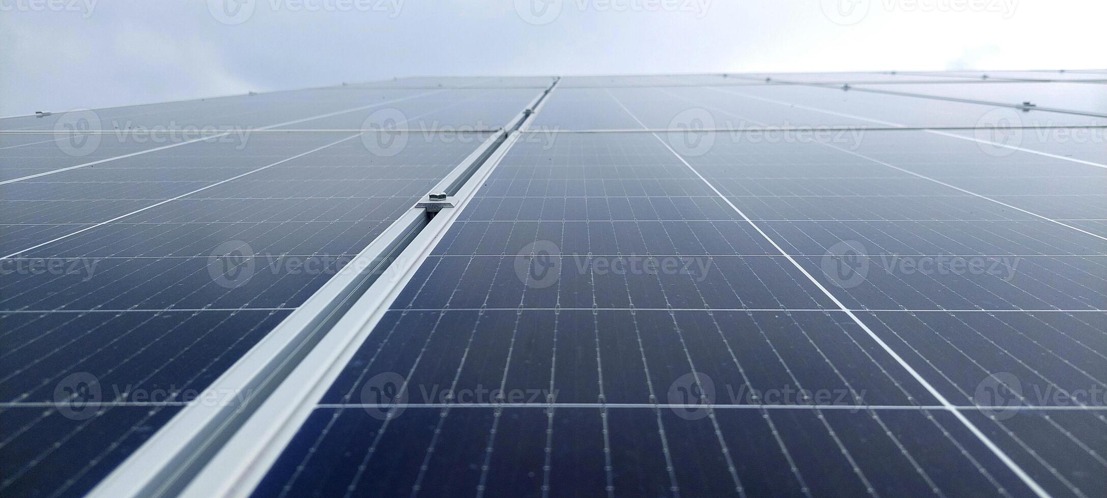 Solar cell panels with a sky background. Solar battery farm. An alternative source of electricity photo