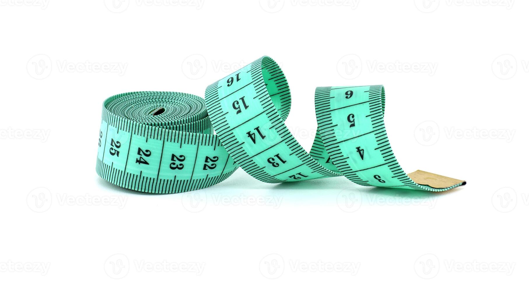 Green measuring tape isolated on white background photo
