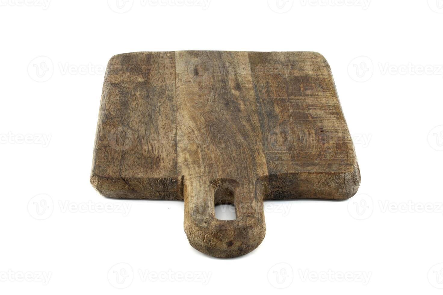 Wooden cutting board with a handle isolated on a white background photo