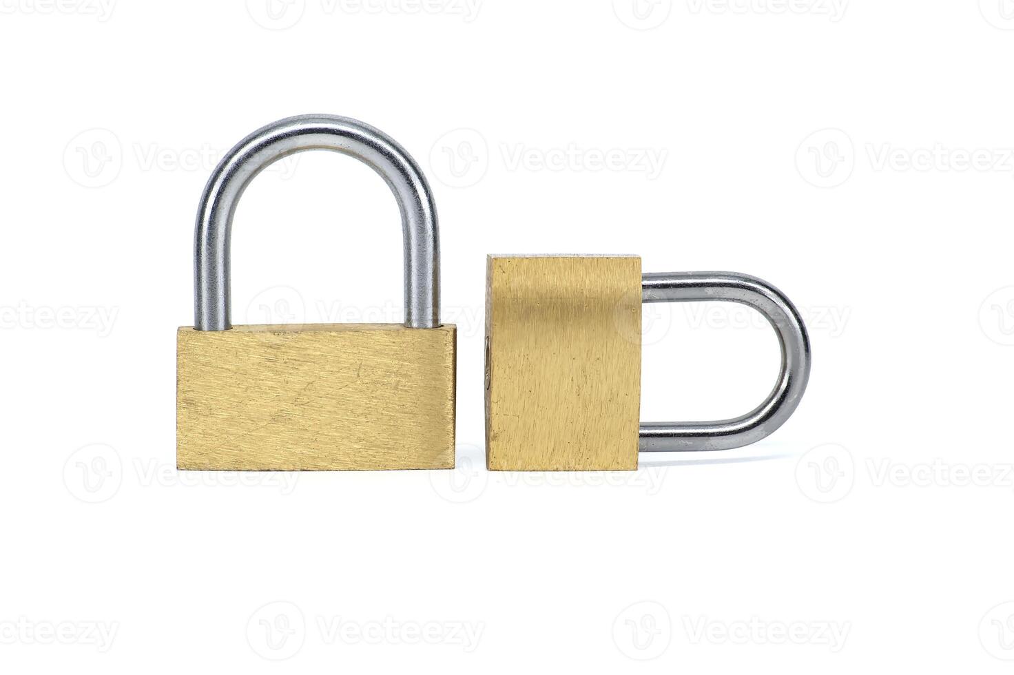 Two shiny gold padlocks isolated on white background photo