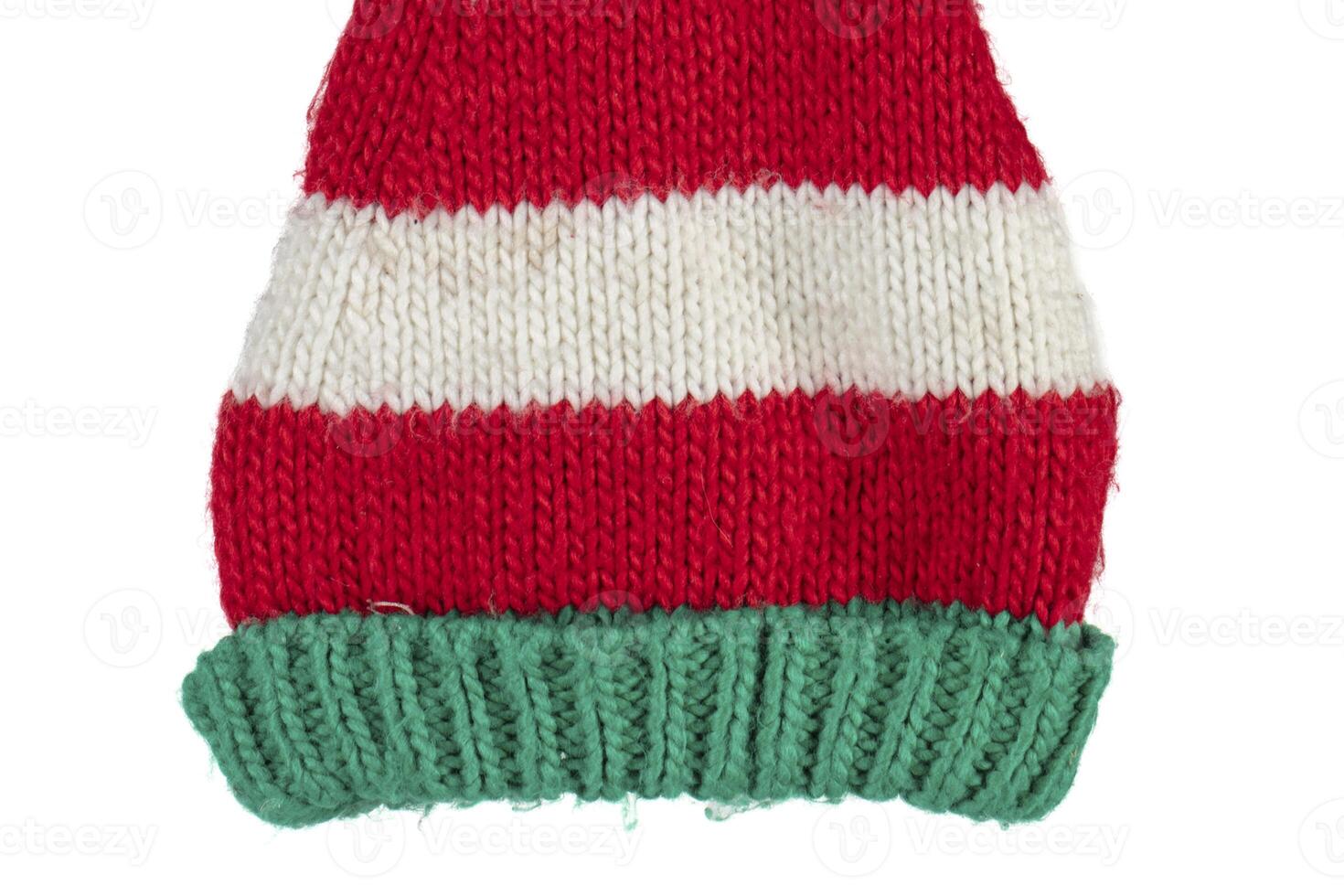 Part of a Knitted Christmas hat on a white background. Funny New Year's hat. photo