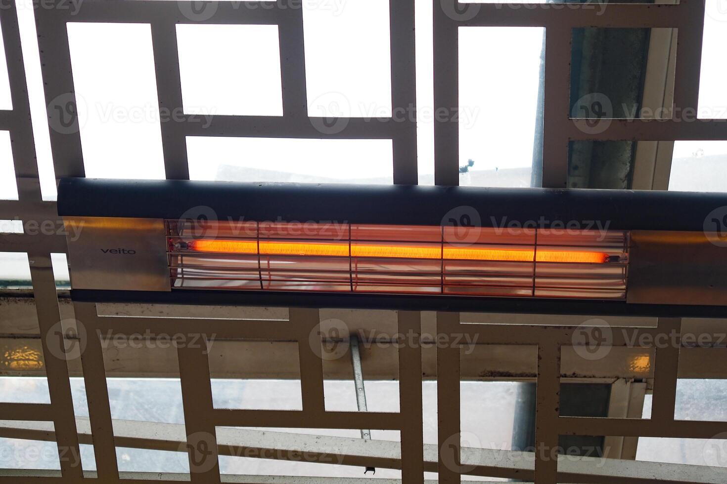 Modern electric infrared heater on celling photo