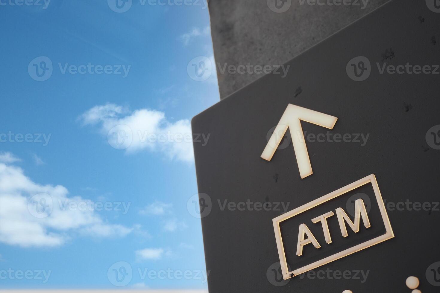 ATM sign on the side of a wall, photo