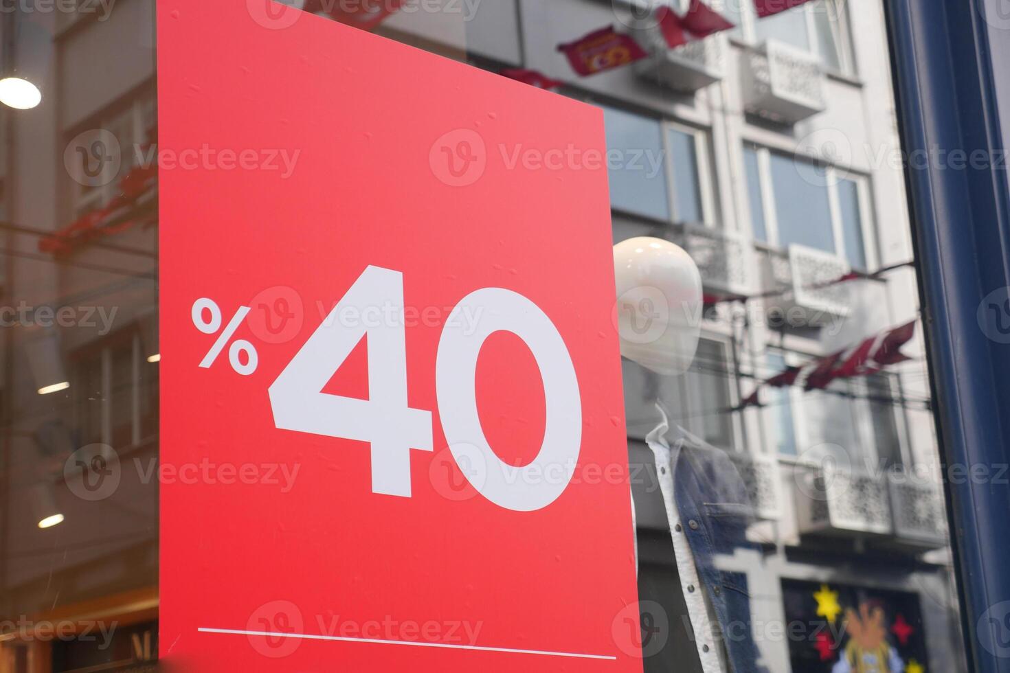Large Sale text letters on red background on clothing store . photo