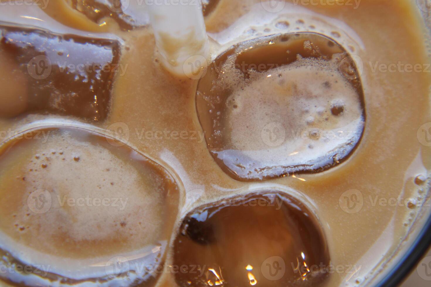 Close up of ice cubes in a glass of coffee, photo