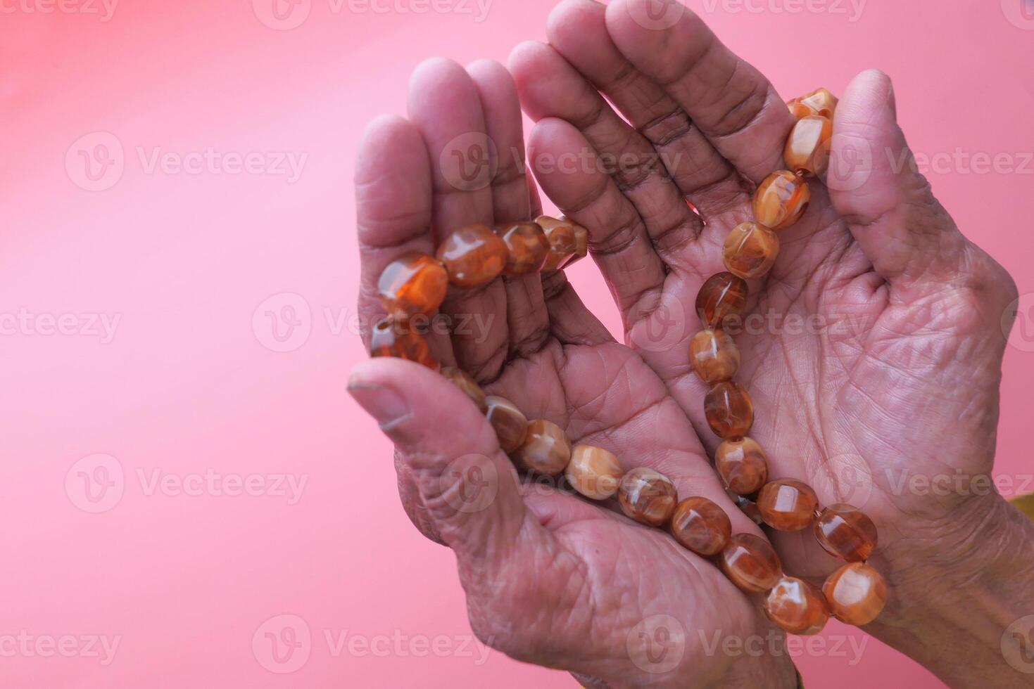 Close up of senior women hand praying with copy space photo
