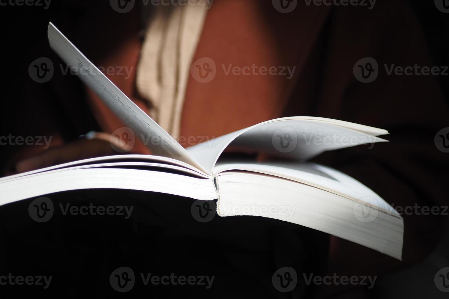 Close up of women hand turning a pager of a diary photo