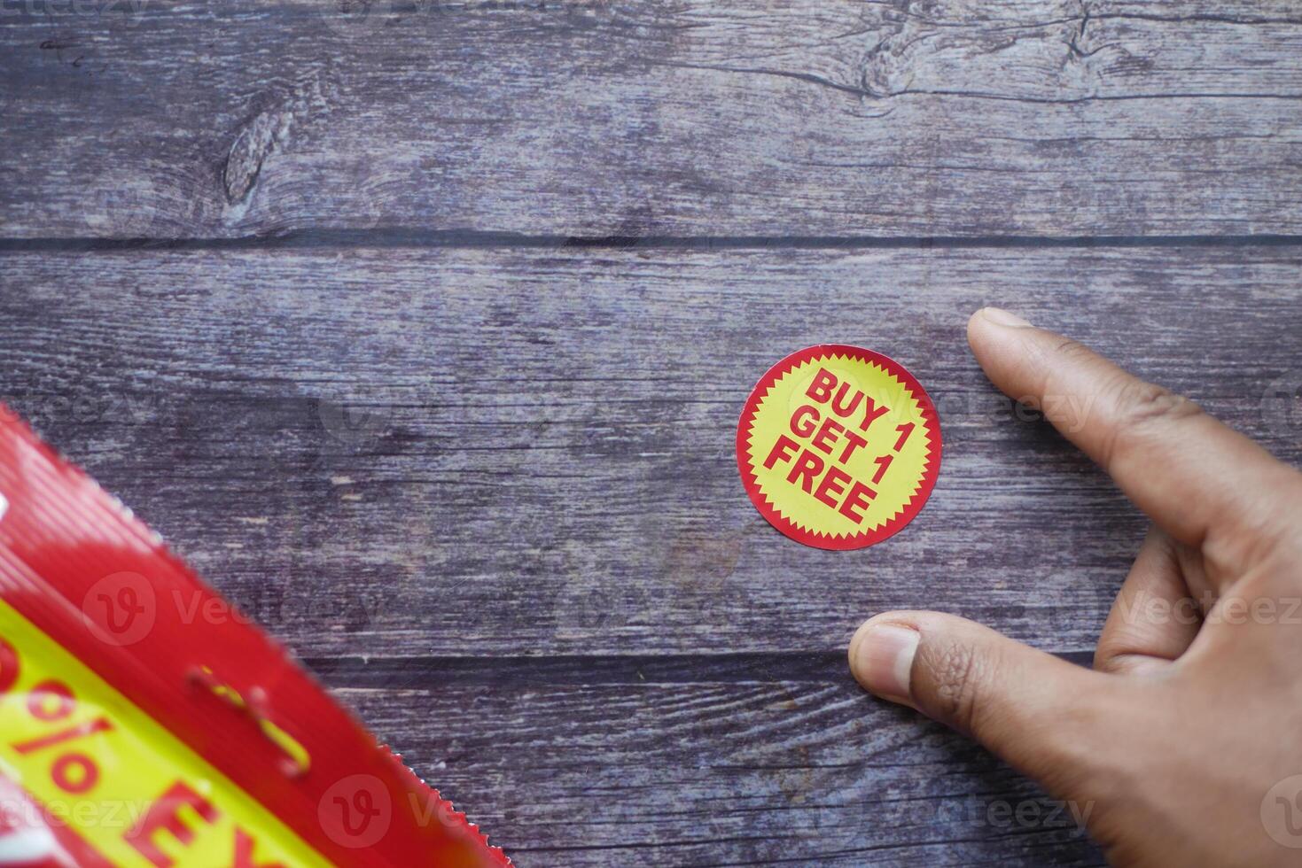 buy 1 get 1 free offer sticker and prodcuts on table photo