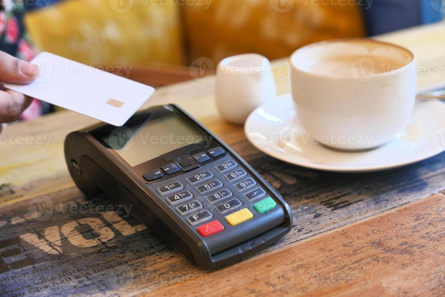 Payment terminal charging from a credit card , close up photo