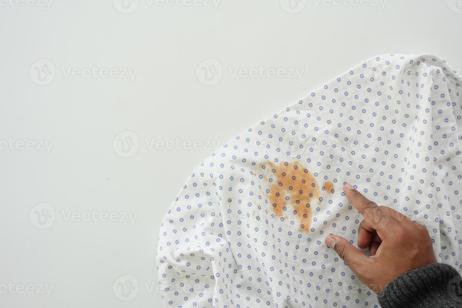 man pointing dirty cloths , showing making stain photo