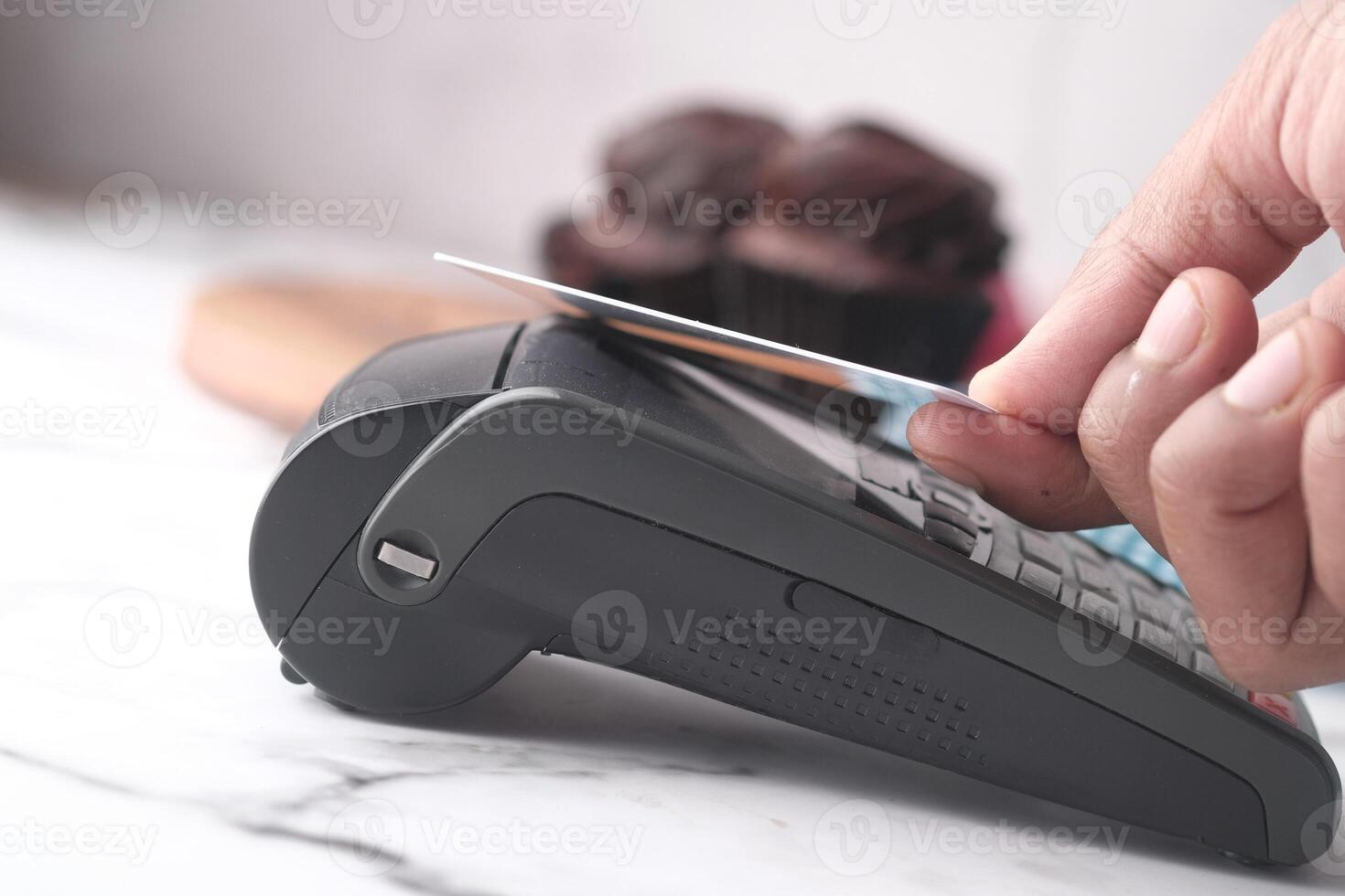 Payment terminal charging from a credit card , close up photo