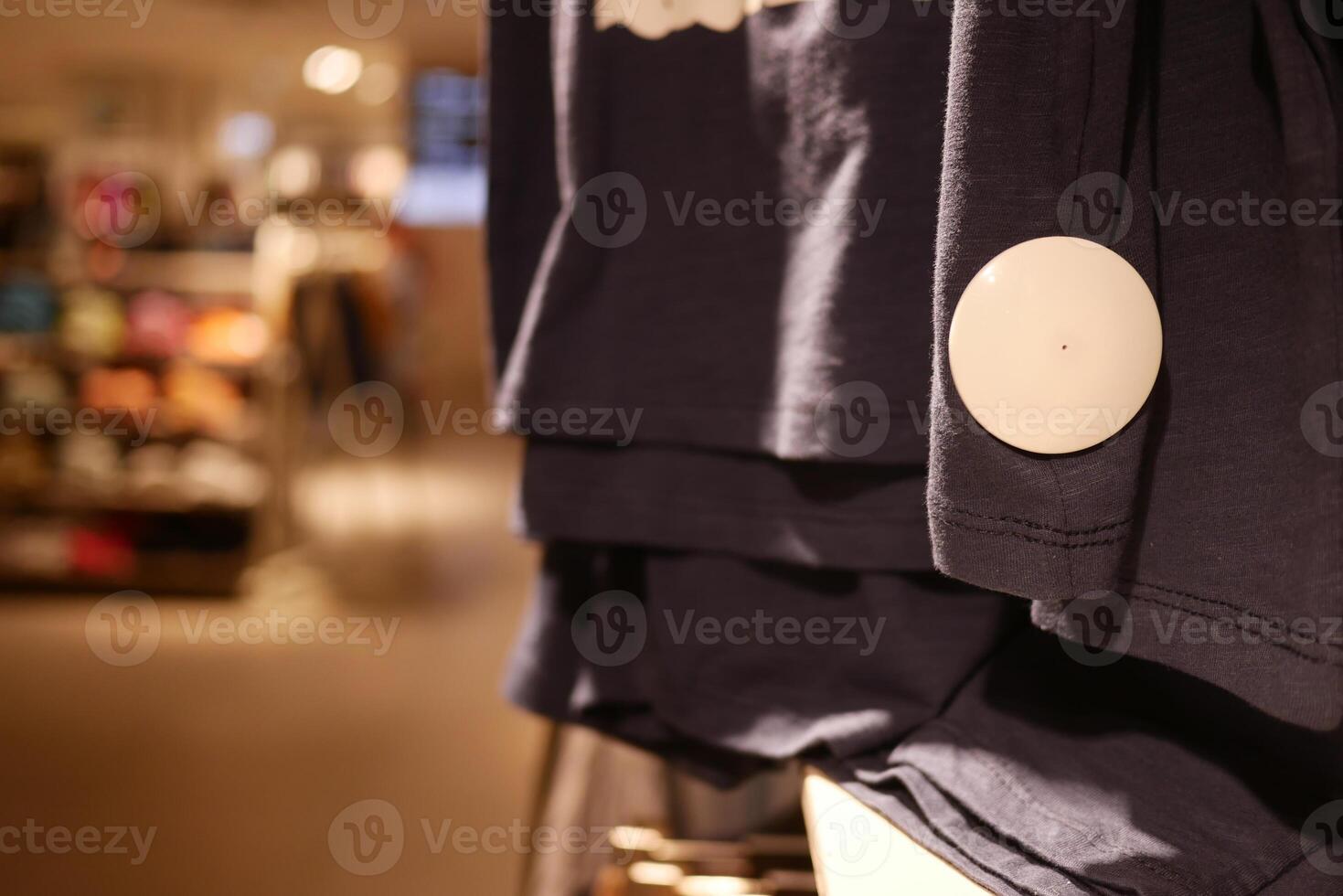 Clothing security tag on a shirt , photo