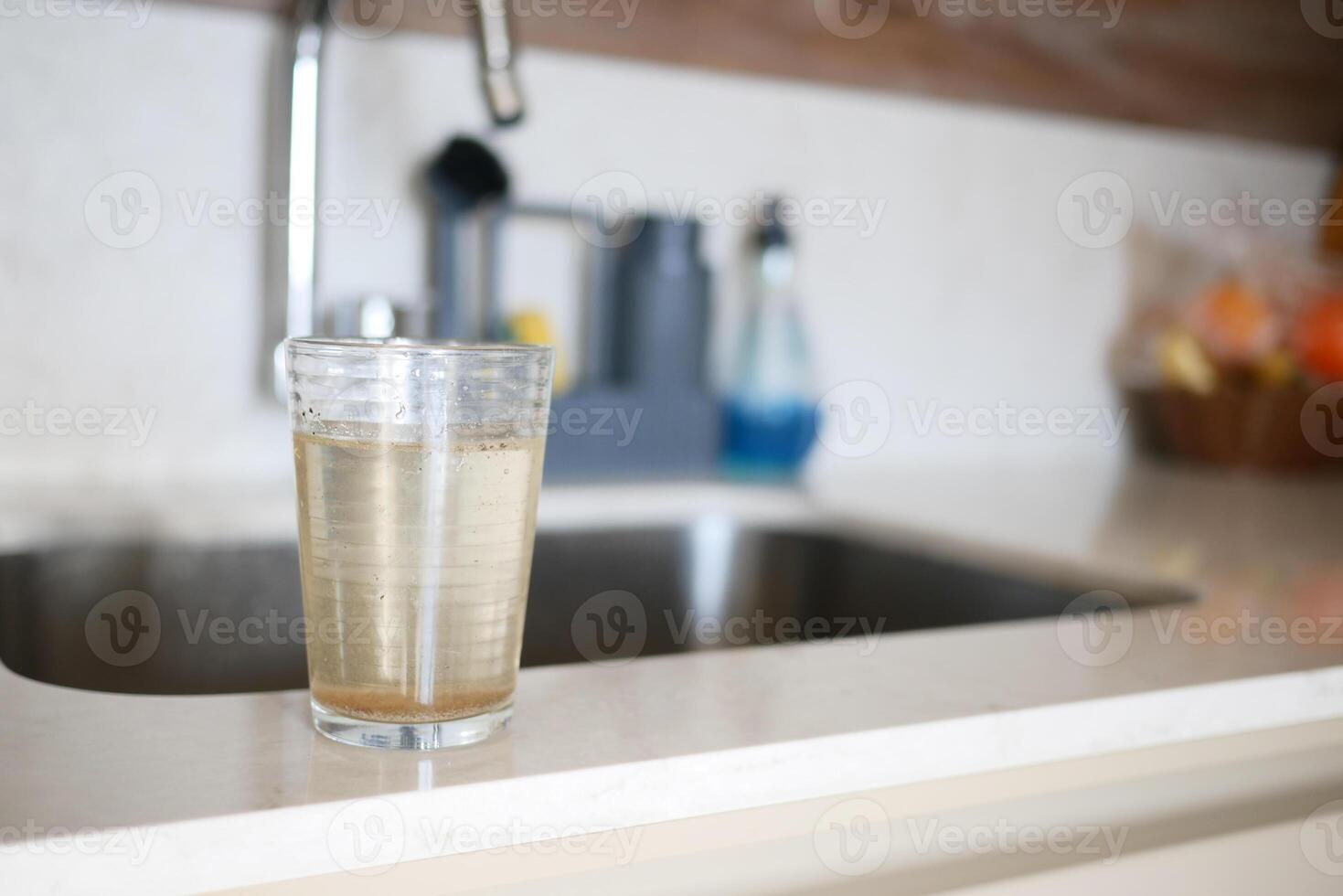 dirty glass of water in a kitchen environment photo