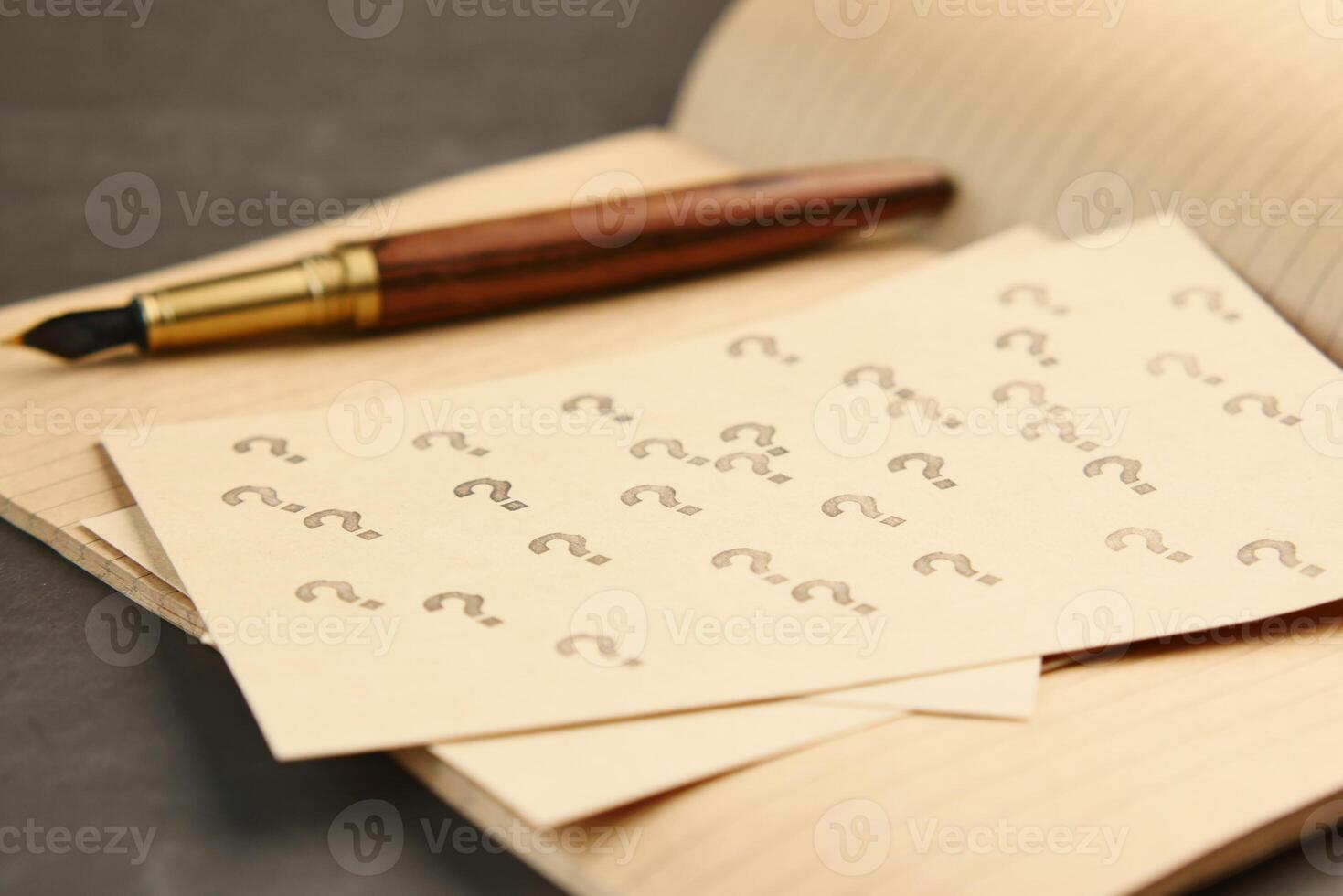 high angle view of question mark on paper on office desk photo