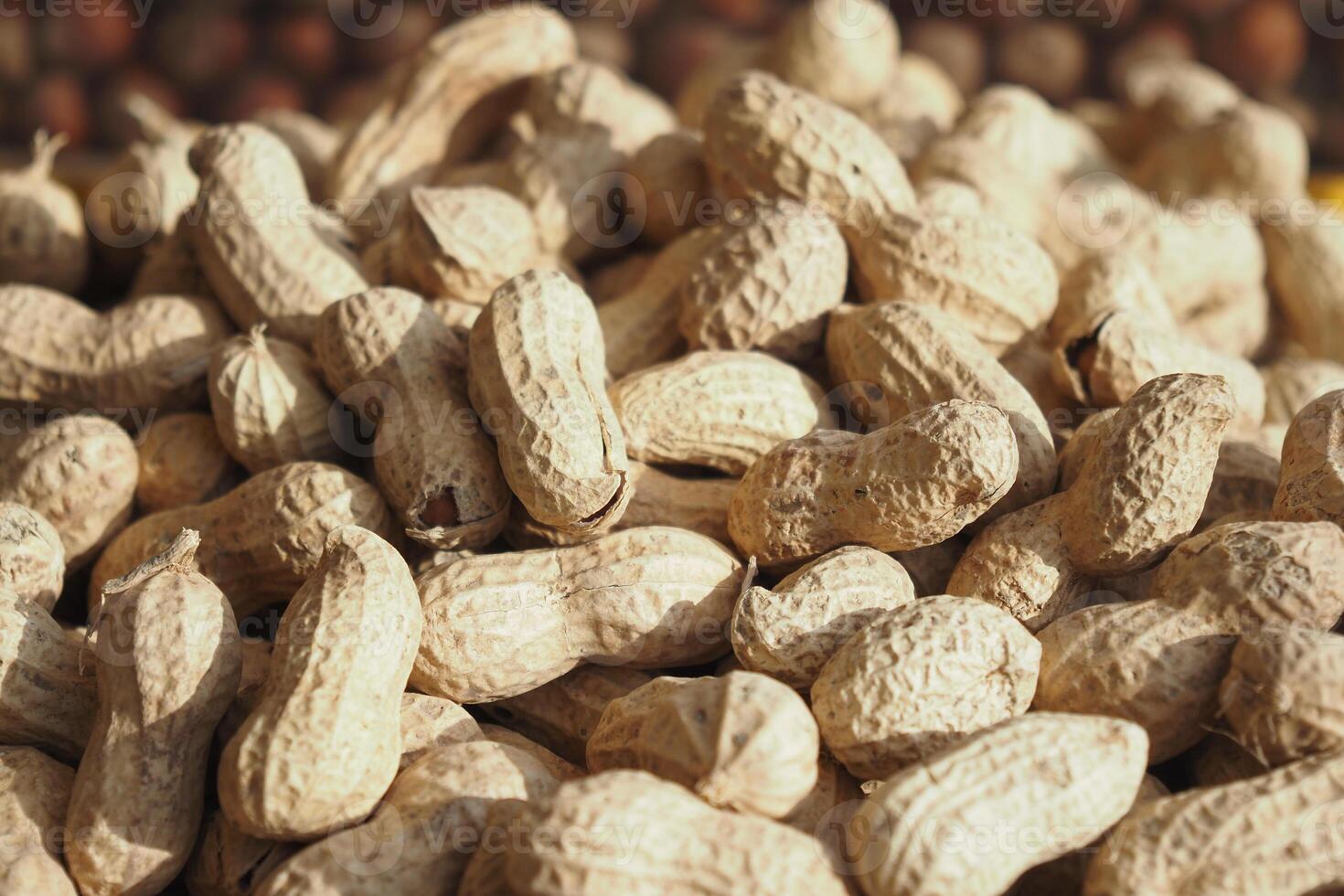 top view of Several peanuts in a basket. photo