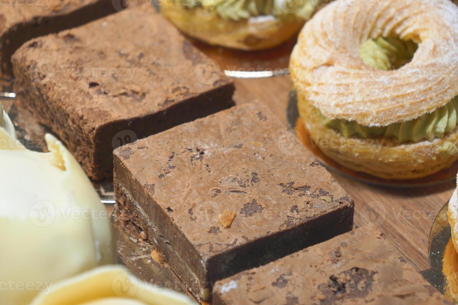 Closeup of assorted pastries and brownies, a delicious selection for sweet cravings photo