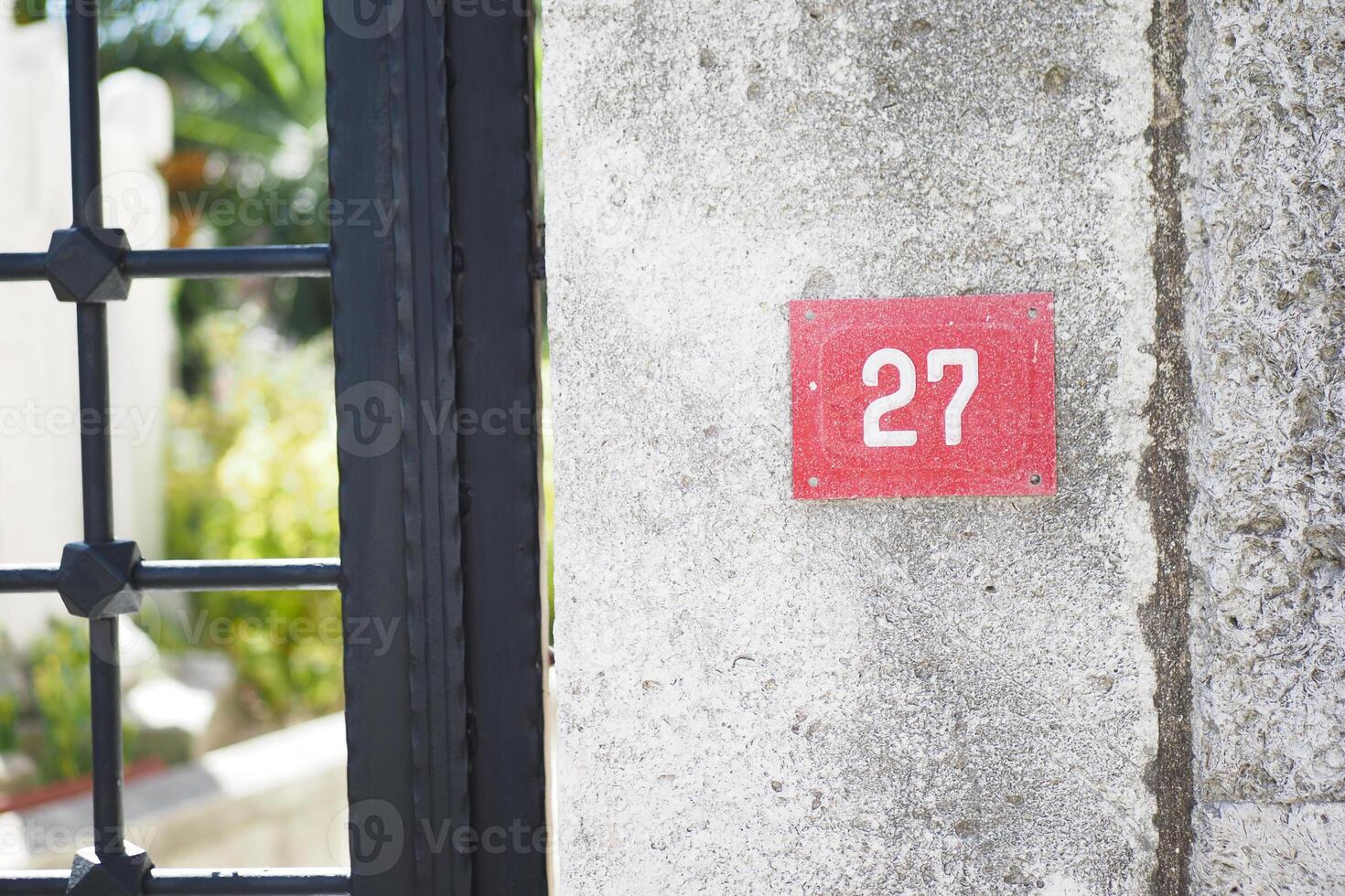 house number. Decorative lettering on a brick wall. photo