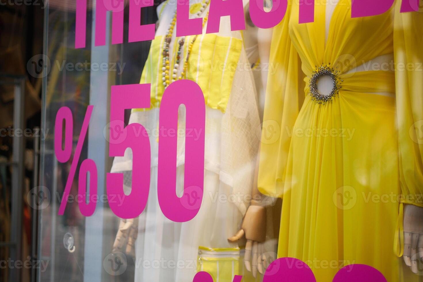 Large Sale text letters on red background on clothing store . photo
